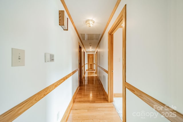 12705 Caldwell Rd, Charlotte, NC 28213 - corridor featuring light wood-type flooring and crown molding