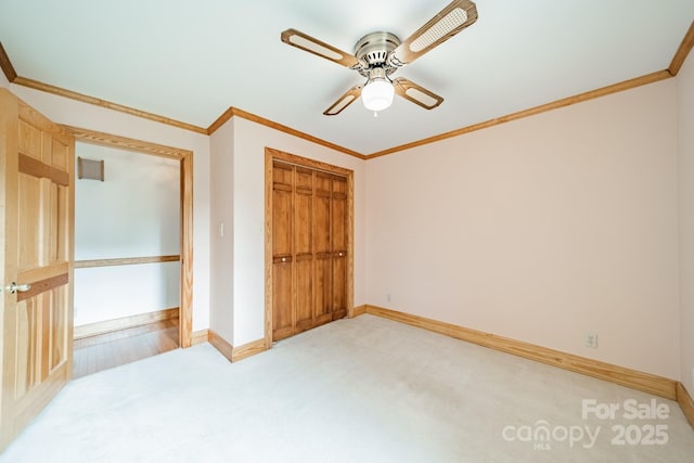 12705 Caldwell Rd, Charlotte, NC 28213 - unfurnished bedroom featuring light colored carpet, ornamental molding, a closet, and a ceiling fan