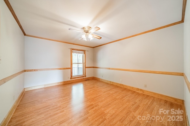 12705 Caldwell Rd, Charlotte, NC 28213 - spare room featuring crown molding, wood finished floors, and a ceiling fan