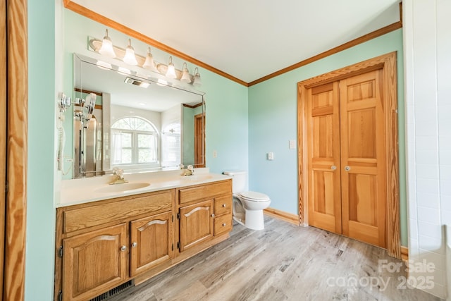12705 Caldwell Rd, Charlotte, NC 28213 - full bath with double vanity, ornamental molding, and wood finished floors