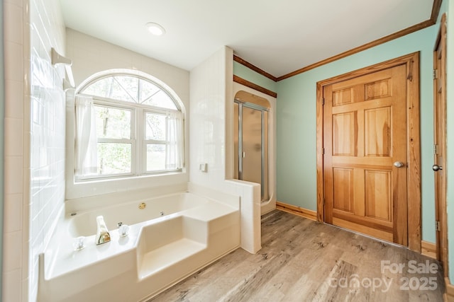 12705 Caldwell Rd, Charlotte, NC 28213 - full bath featuring a stall shower, a jetted tub, wood finished floors, and ornamental molding