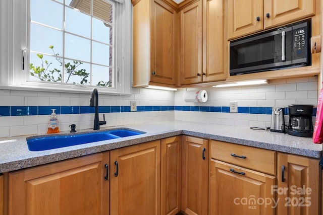 3541 Blankenship Dr, Morganton, NC 28655 - kitchen with black microwave, decorative backsplash, and light stone counters