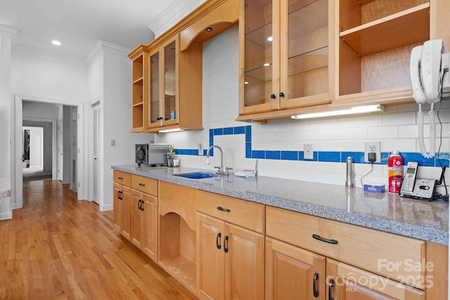 3541 Blankenship Dr, Morganton, NC 28655 - kitchen featuring ornamental molding, tasteful backsplash, light wood-style floors, glass insert cabinets, and open shelves