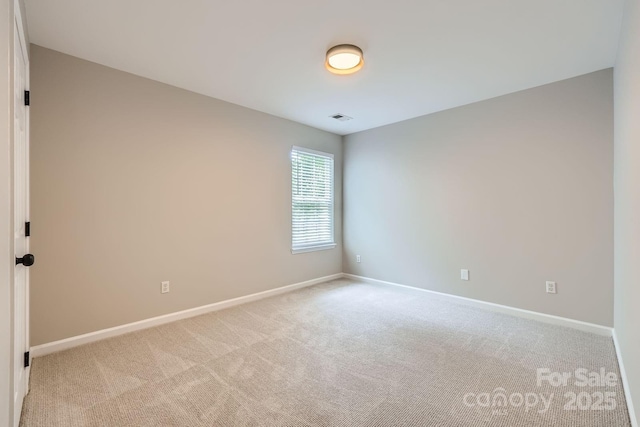 7810 Leisure Ln, Huntersville, NC 28078 - unfurnished room featuring baseboards and light colored carpet