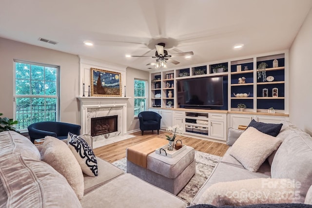 7810 Leisure Ln, Huntersville, NC 28078 - living room with light wood finished floors, a fireplace, ceiling fan, and recessed lighting