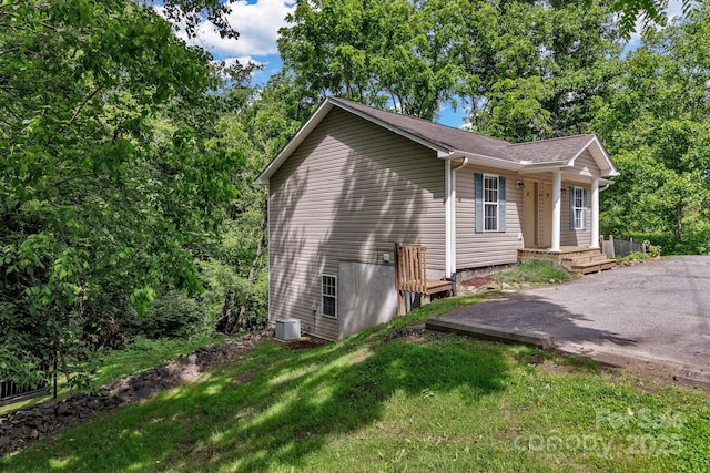 222 New Stock Rd, Weaverville, NC 28787 - view of home's exterior with a central air condition unit and a yard
