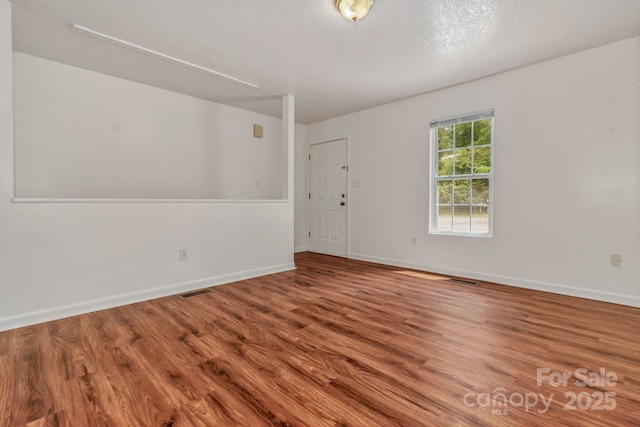 222 New Stock Rd, Weaverville, NC 28787 - unfurnished room with wood finished floors and a textured ceiling