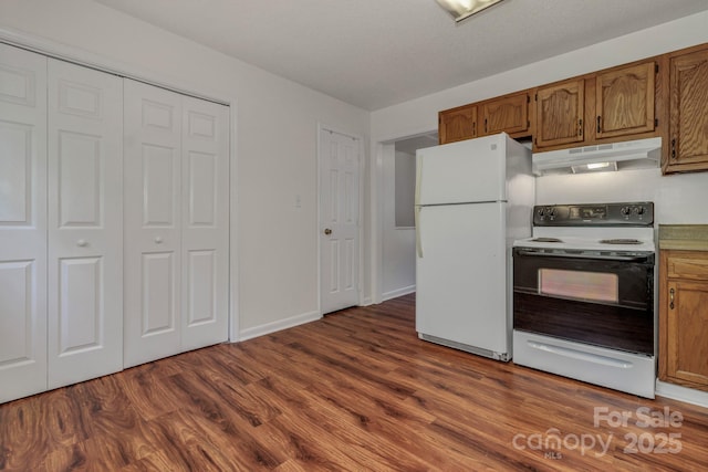 222 New Stock Rd, Weaverville, NC 28787 - kitchen with range with electric stovetop, freestanding refrigerator, under cabinet range hood, and dark wood-style flooring