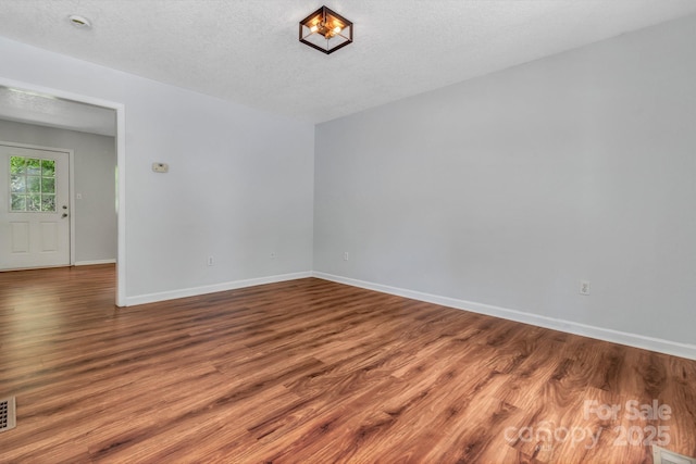 222 New Stock Rd, Weaverville, NC 28787 - empty room featuring wood finished floors and a textured ceiling