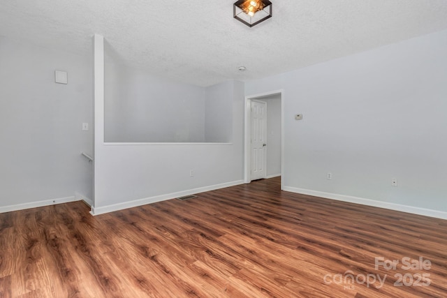 222 New Stock Rd, Weaverville, NC 28787 - empty room featuring wood finished floors and a textured ceiling