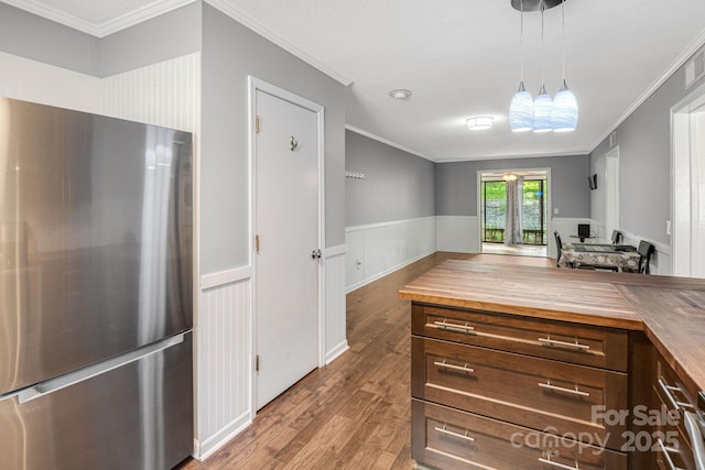 15 Lake Dr Unit D2, Laurel Park, NC 28739 - kitchen featuring freestanding refrigerator, ornamental molding, wood counters, wood finished floors, and open floor plan