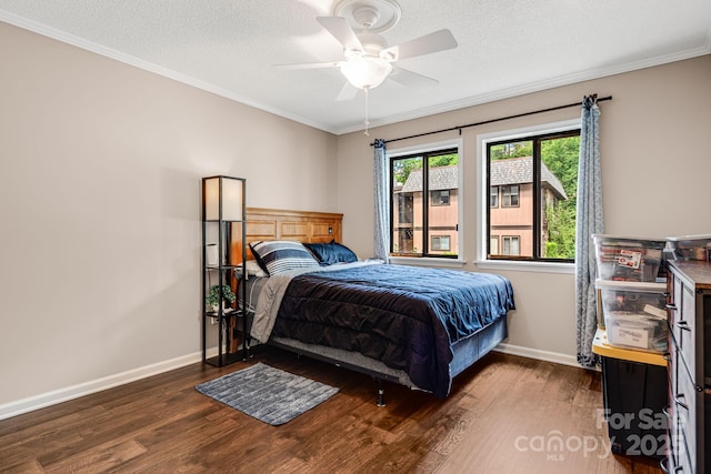 15 Lake Dr Unit D2, Laurel Park, NC 28739 - bedroom with dark wood-style floors, ornamental molding, baseboards, a ceiling fan, and a textured ceiling