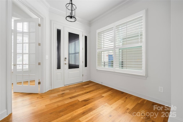 3008 Laney Pond Rd, Matthews, NC 28104 - foyer featuring light wood-style flooring, crown molding, and baseboards