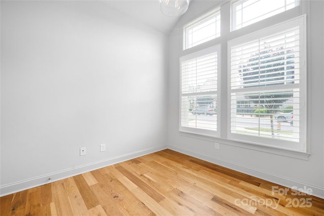 3008 Laney Pond Rd, Matthews, NC 28104 - spare room with light wood-style flooring, baseboards, and lofted ceiling