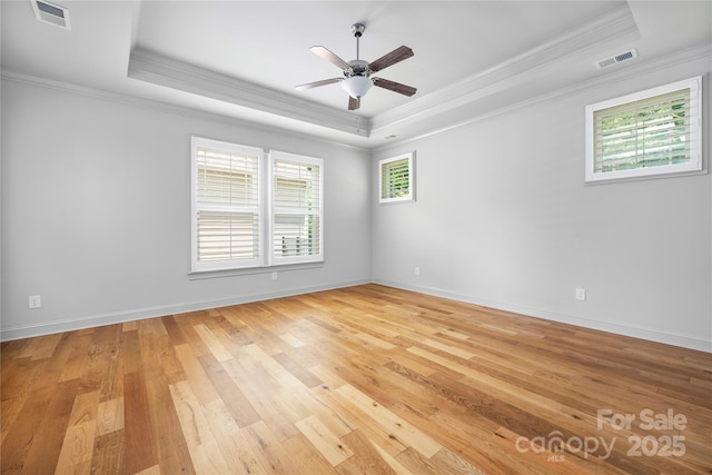 3008 Laney Pond Rd, Matthews, NC 28104 - empty room with a raised ceiling, ornamental molding, a ceiling fan, light wood-style floors, and baseboards