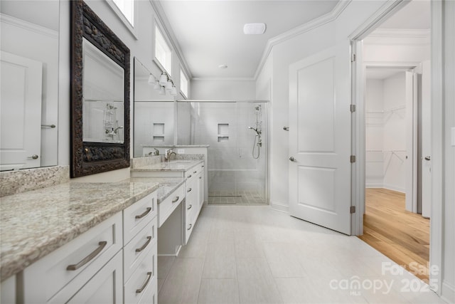 3008 Laney Pond Rd, Matthews, NC 28104 - bathroom with a stall shower, vanity, a spacious closet, and crown molding