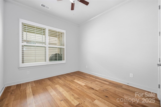 3008 Laney Pond Rd, Matthews, NC 28104 - spare room featuring crown molding, a ceiling fan, light wood-style floors, and baseboards