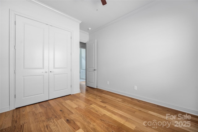 3008 Laney Pond Rd, Matthews, NC 28104 - unfurnished bedroom with crown molding, light wood-style flooring, a closet, baseboards, and ceiling fan