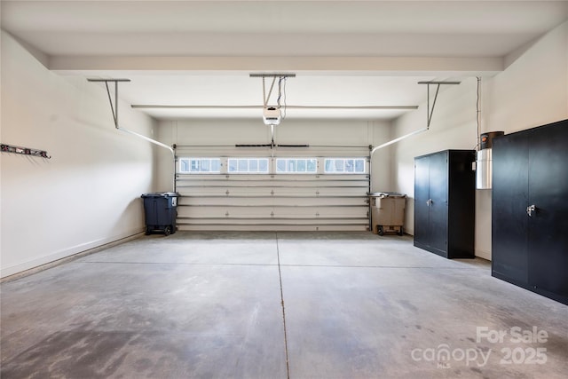 3008 Laney Pond Rd, Matthews, NC 28104 - garage featuring a garage door opener and baseboards