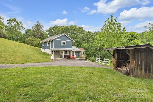 242 Ladd Parsons Rd, Crumpler, NC 28617 - rear view of house with driveway and covered porch