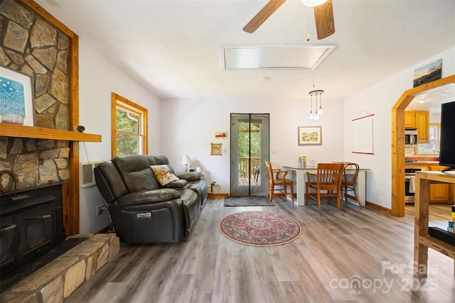 242 Ladd Parsons Rd, Crumpler, NC 28617 - living area with light wood-type flooring, ceiling fan, attic access, and baseboards
