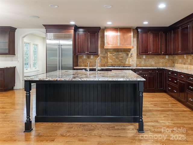 50 Brookline Dr, Asheville, NC 28803 - kitchen with stainless steel appliances, a sink, light wood finished floors, light stone countertops, and recessed lighting