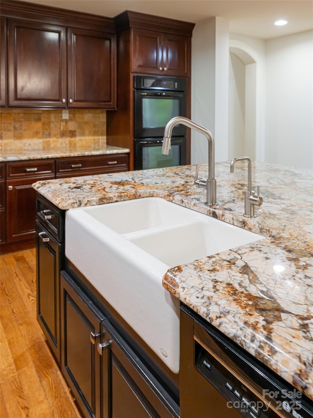 50 Brookline Dr, Asheville, NC 28803 - kitchen featuring light wood finished floors, a sink, recessed lighting, decorative backsplash, and light stone countertops