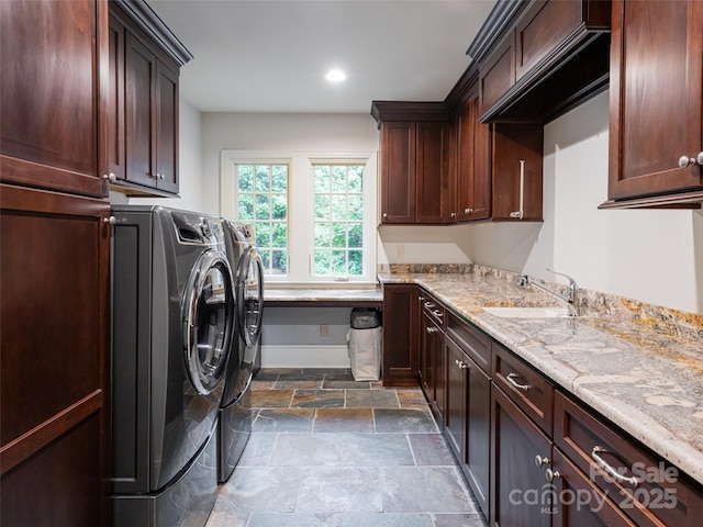 50 Brookline Dr, Asheville, NC 28803 - washroom featuring washer and dryer, cabinet space, stone tile floors, baseboards, and recessed lighting