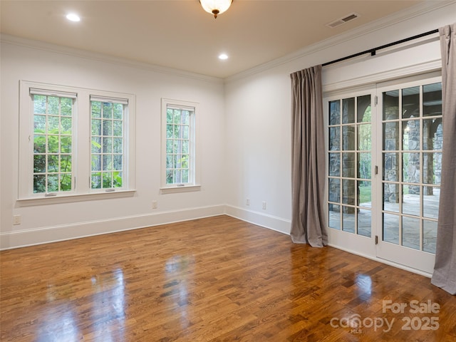 50 Brookline Dr, Asheville, NC 28803 - spare room featuring crown molding, wood finished floors, baseboards, and recessed lighting