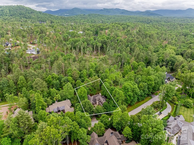 50 Brookline Dr, Asheville, NC 28803 - aerial view of property and surrounding area featuring a forest, a mountainous background, and property parcel outlined