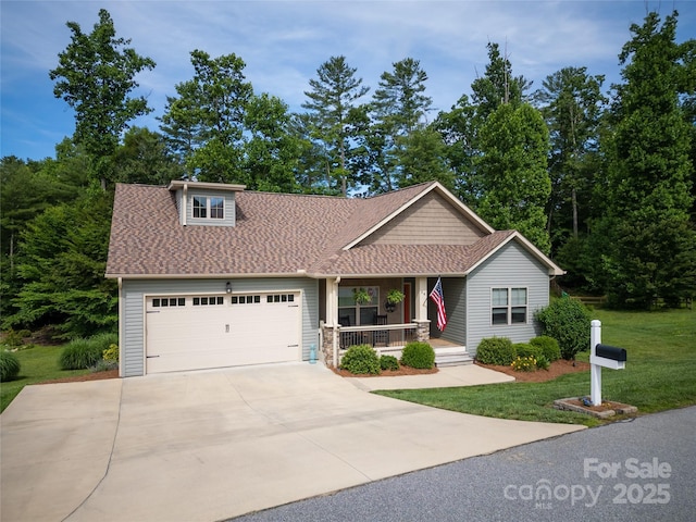 54 Asher Ln, Etowah, NC 28729 - view of front facade featuring covered porch, an attached garage, concrete driveway, a shingled roof, and a front lawn