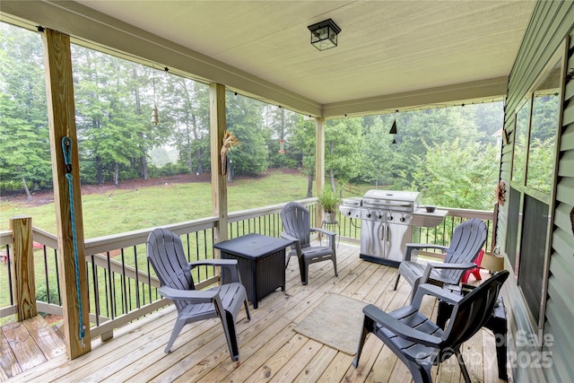 54 Asher Ln, Etowah, NC 28729 - wooden deck with area for grilling, a lawn, and view of wooded area