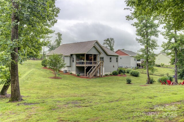 54 Asher Ln, Etowah, NC 28729 - back of property with stairway, a deck, a yard, and a shingled roof