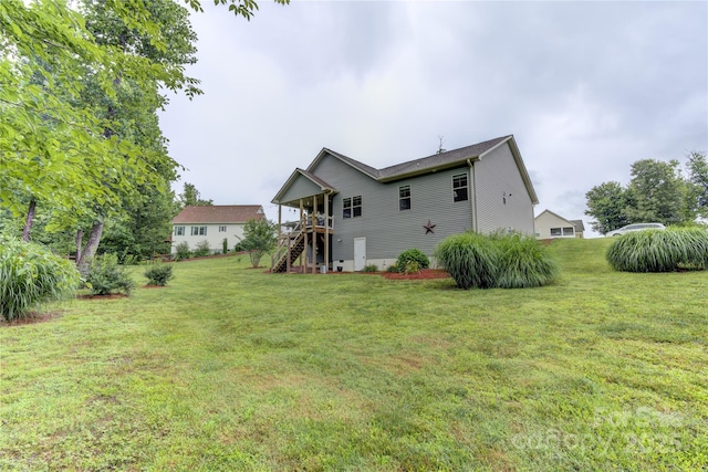 54 Asher Ln, Etowah, NC 28729 - back of house with stairs and a yard