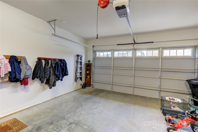 54 Asher Ln, Etowah, NC 28729 - garage featuring a garage door opener and baseboards