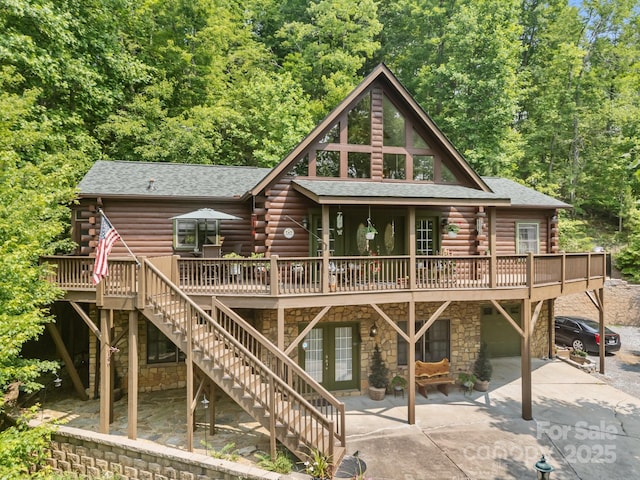 158 Raven Blvd, Lake Lure, NC 28746 - back of property featuring log siding, a deck, and stone siding