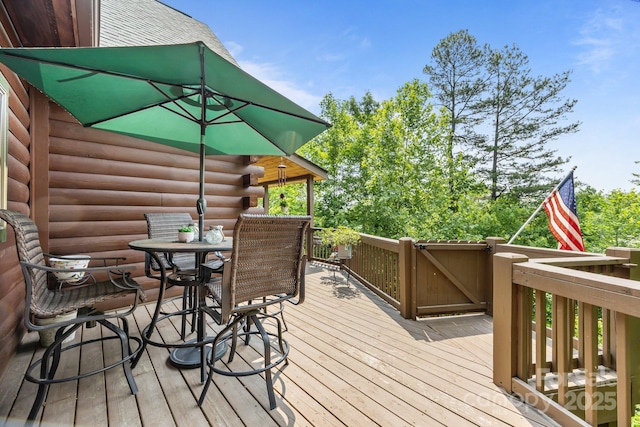 158 Raven Blvd, Lake Lure, NC 28746 - wooden terrace with outdoor dining area