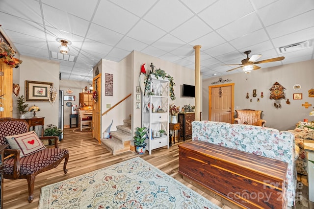 158 Raven Blvd, Lake Lure, NC 28746 - living room featuring a drop ceiling, light wood finished floors, stairs, and a ceiling fan