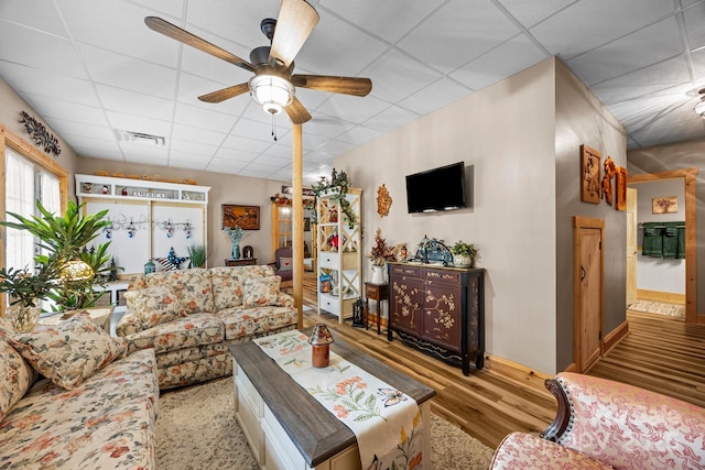 158 Raven Blvd, Lake Lure, NC 28746 - living area with a paneled ceiling, wood finished floors, a ceiling fan, and baseboards