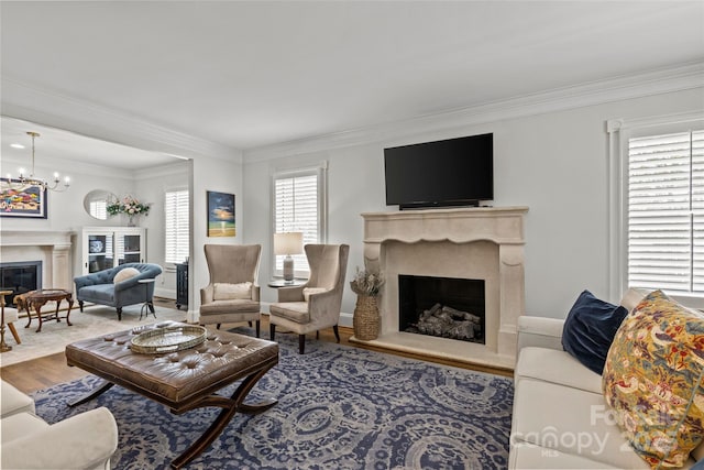 1619 Providence Rd, Charlotte, NC 28207 - living room featuring a high end fireplace, crown molding, wood finished floors, and a chandelier