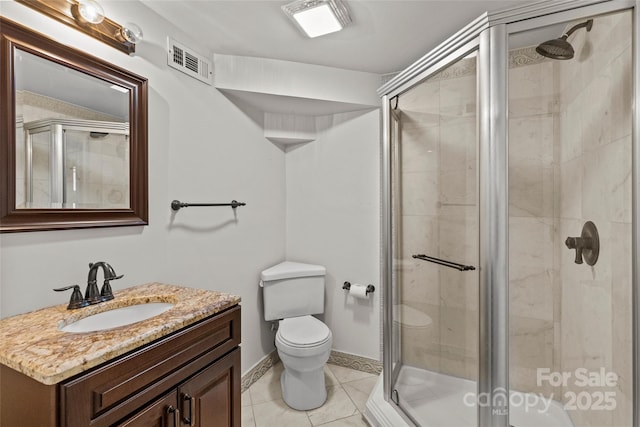 1619 Providence Rd, Charlotte, NC 28207 - full bathroom with toilet, vanity, a shower stall, tile patterned flooring, and baseboards