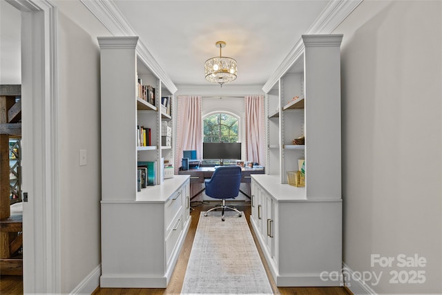 1619 Providence Rd, Charlotte, NC 28207 - office space featuring a chandelier, built in study area, light wood-style flooring, ornamental molding, and baseboards