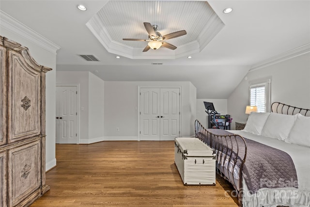 1619 Providence Rd, Charlotte, NC 28207 - bedroom with a tray ceiling, crown molding, wood finished floors, recessed lighting, and baseboards