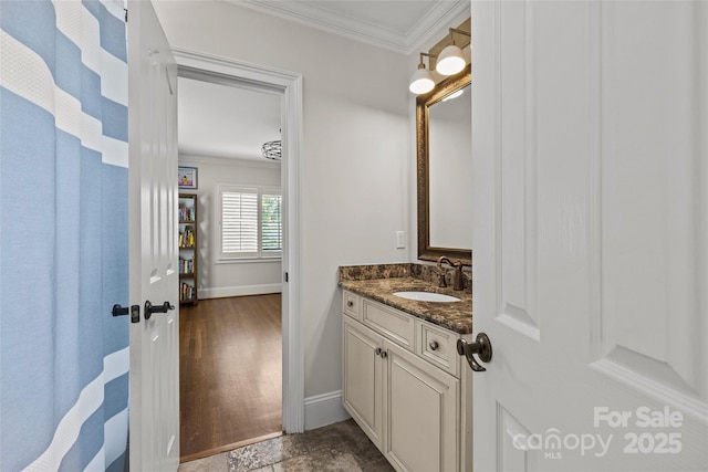 1619 Providence Rd, Charlotte, NC 28207 - bathroom featuring ornamental molding, vanity, and baseboards