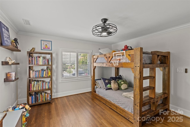 1619 Providence Rd, Charlotte, NC 28207 - bedroom featuring baseboards, ornamental molding, and wood finished floors