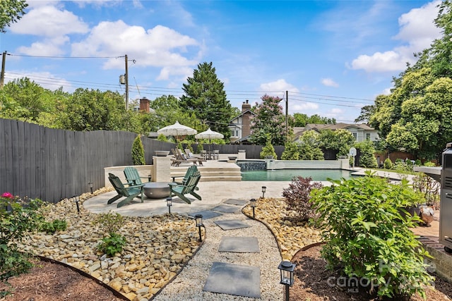 1619 Providence Rd, Charlotte, NC 28207 - fenced backyard featuring a patio area and an outdoor fire pit