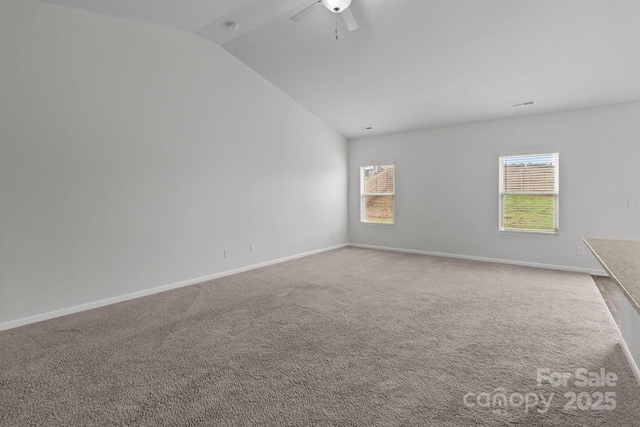 5314 Upton Pl, Charlotte, NC 28215 - spare room featuring vaulted ceiling, carpet flooring, and a ceiling fan
