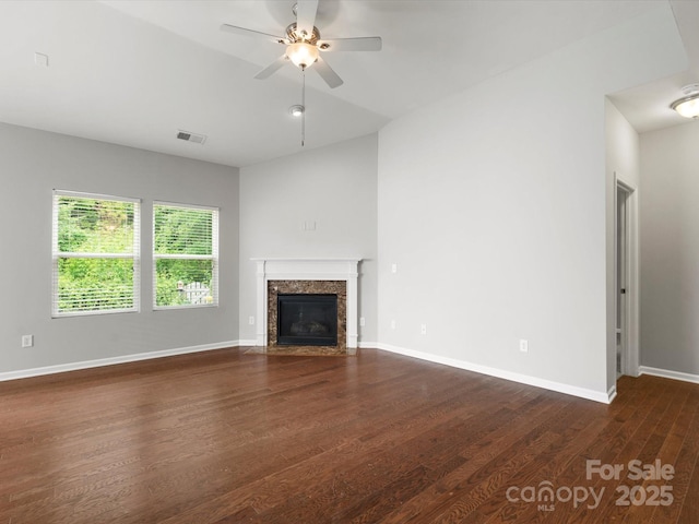 1660 Beleek Ridge Ln, Lake Wylie, SC 29710 - unfurnished living room with dark wood finished floors, a ceiling fan, a high end fireplace, and baseboards