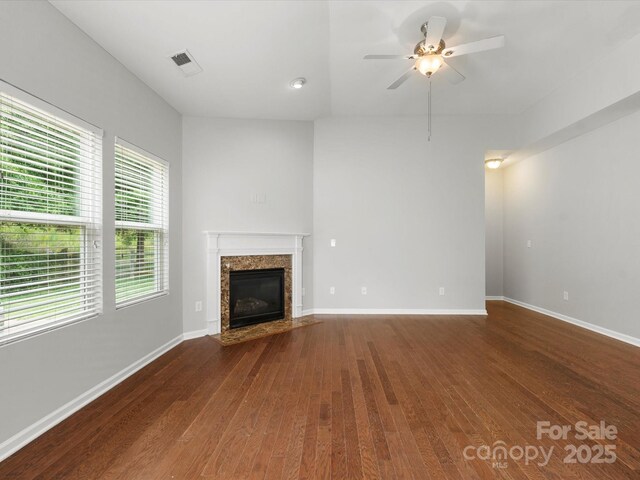 1660 Beleek Ridge Ln, Lake Wylie, SC 29710 - unfurnished living room featuring hardwood / wood-style flooring, ceiling fan, a fireplace, and baseboards