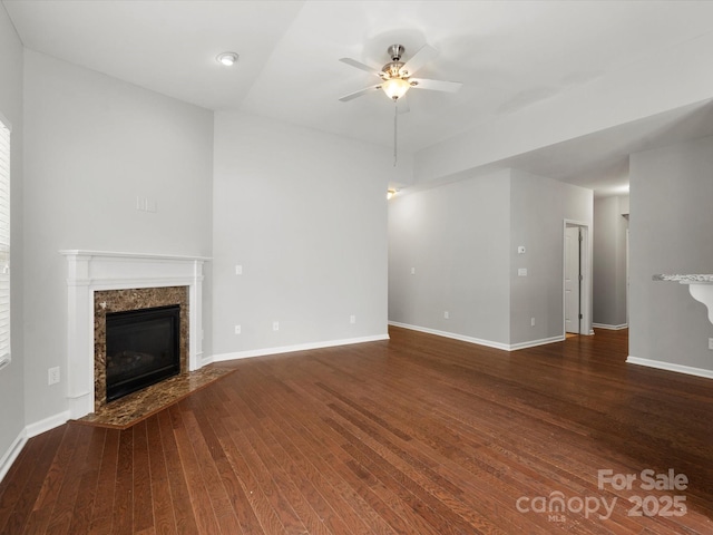 1660 Beleek Ridge Ln, Lake Wylie, SC 29710 - unfurnished living room with ceiling fan, wood finished floors, a high end fireplace, and baseboards